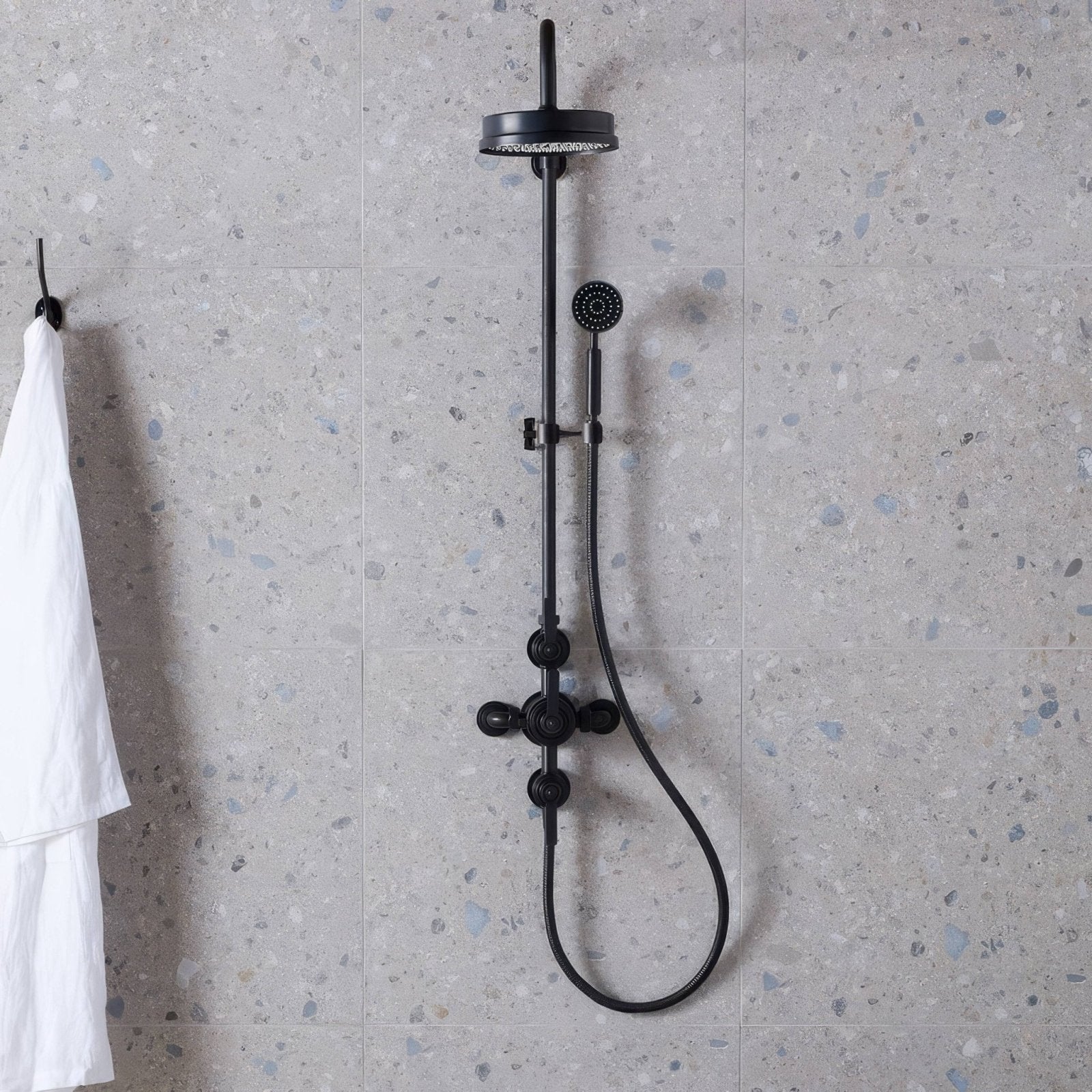 Black matte finished shower system with rainhead and handheld nozzle mounted on a vertical bar Reykjavik Ash 60 x 30cm