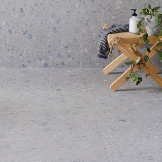Gray terrazzo tiles with blue white and black flecks reykjavik ash 60 x 60cm for flooring and wall use