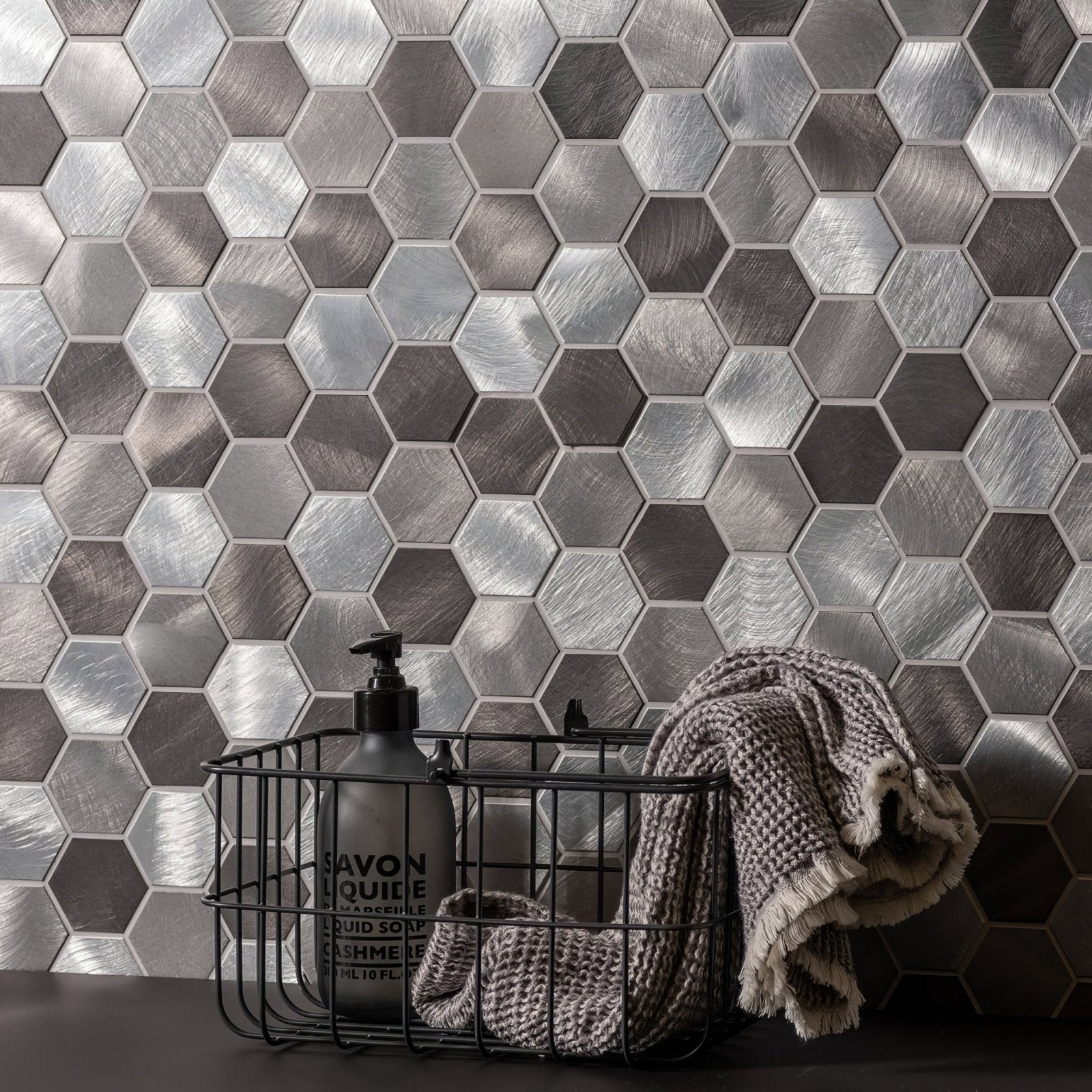 Silver hexagonal metal mosaic tile wall from the Rhea grey and silver mixed hexagon mosaic collection