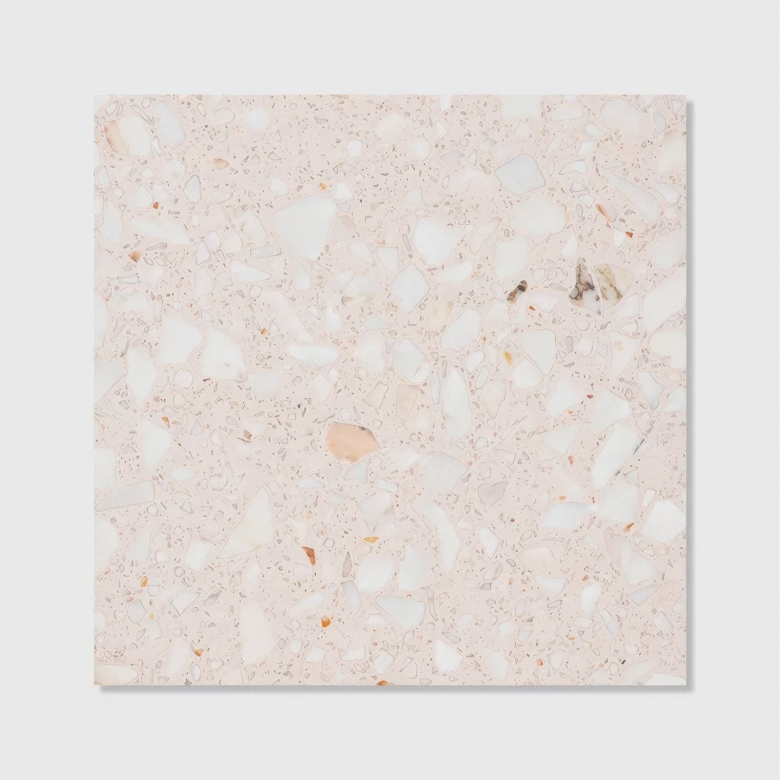 A square rialto terrazzo ballerin honed tile with soft pinkish beige base and white gray peach aggregate pieces