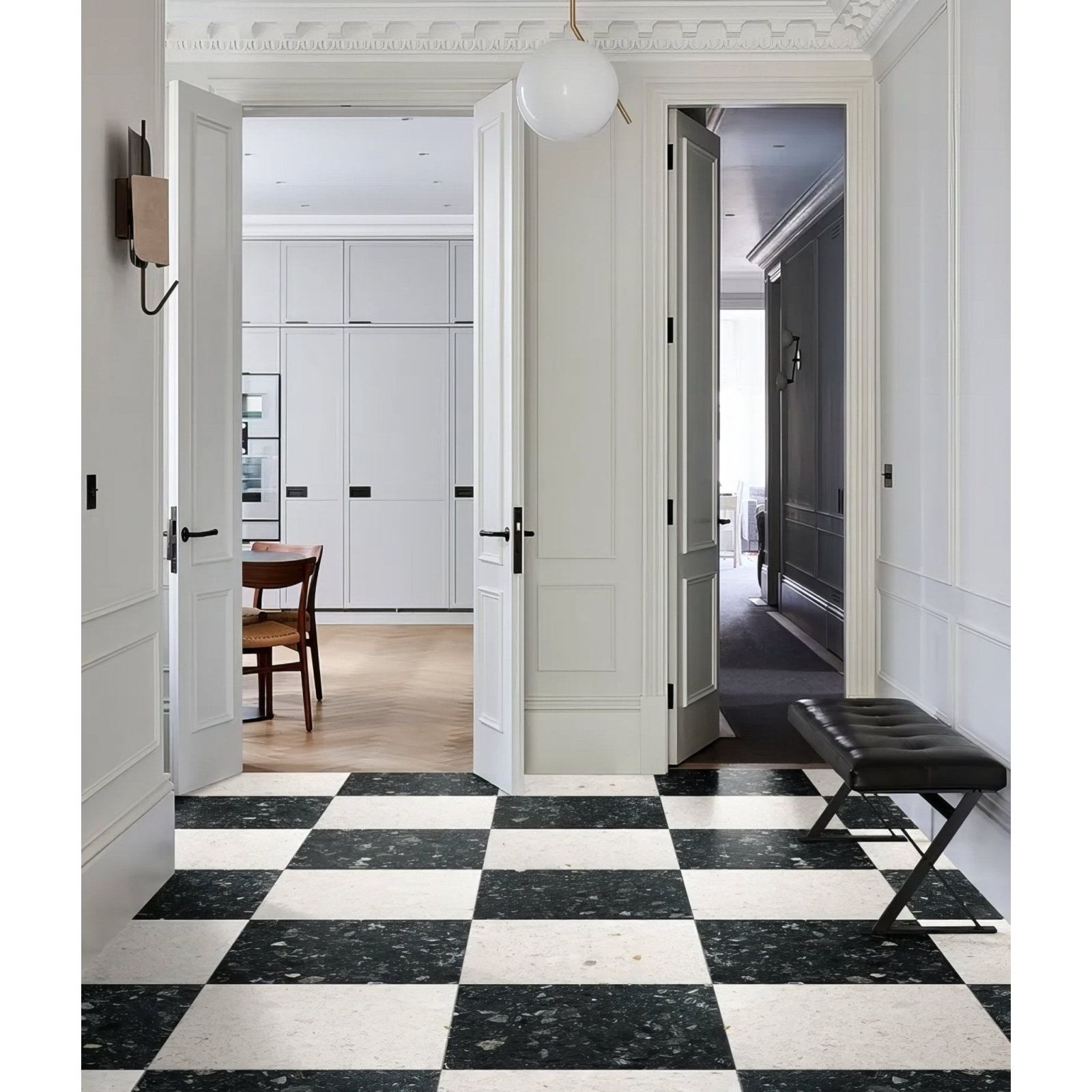 Rialto Terrazzo Foscari Honed dark green terrazzo tiles with a black leather bench