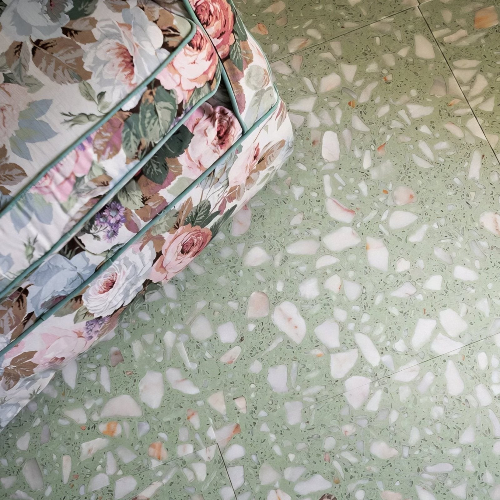 Rialto Terrazzo Laguna Honed light green terrazzo tiles with a floral cushion