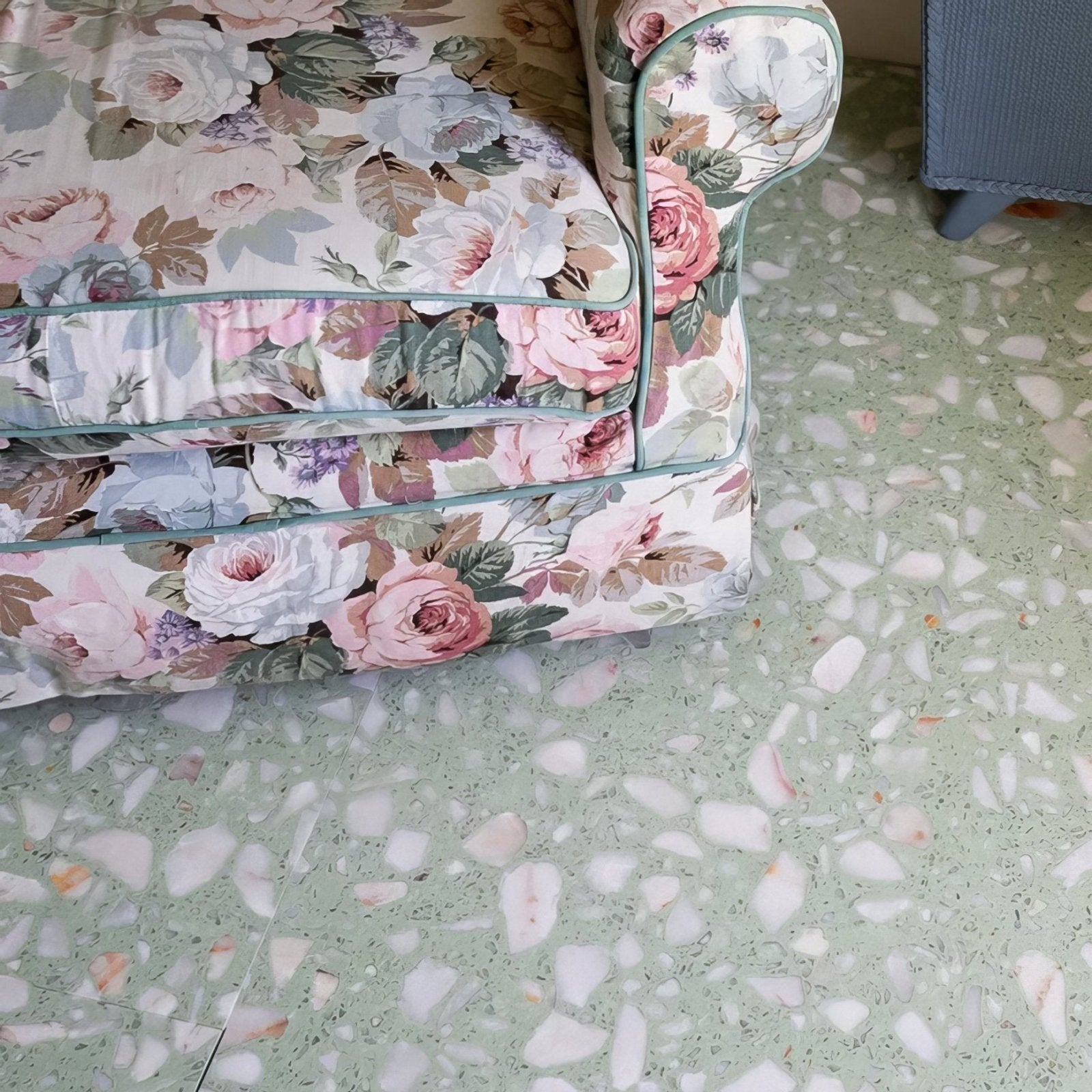 Rialto Terrazzo Laguna Honed light green terrazzo tiles with a floral armchair