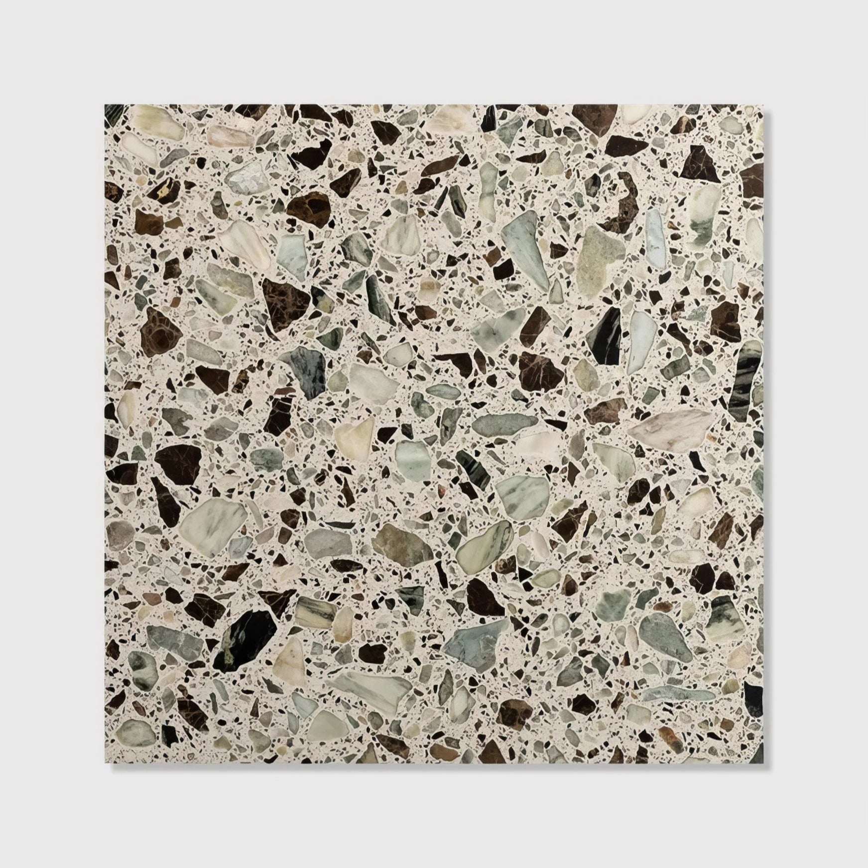 A square rialto terrazzo san polo honed tile with dark brown black and light gray stone fragments in beige mortar