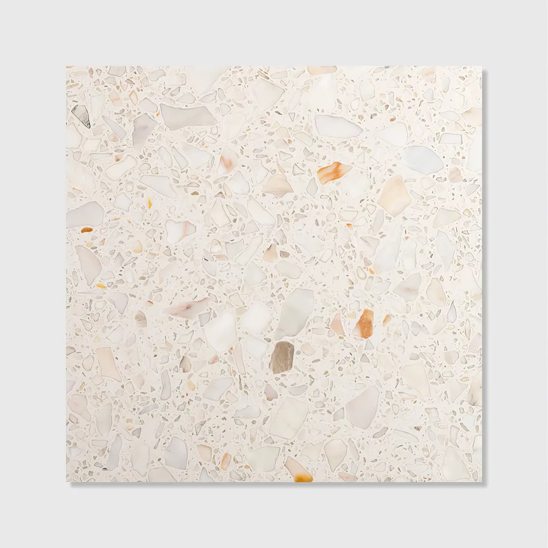 A square rialto terrazzo veneta honed tile with creamy white base and scattered beige pink and muted orange marble fragments