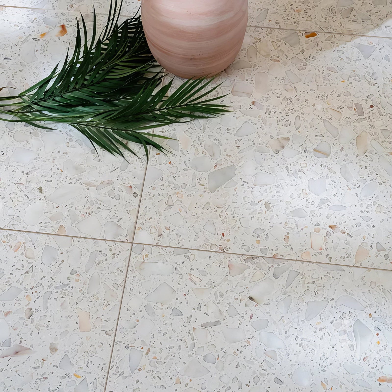 Rialto Terrazzo Veneta Honed soft pink terrazzo tiles with a pink ceramic vase