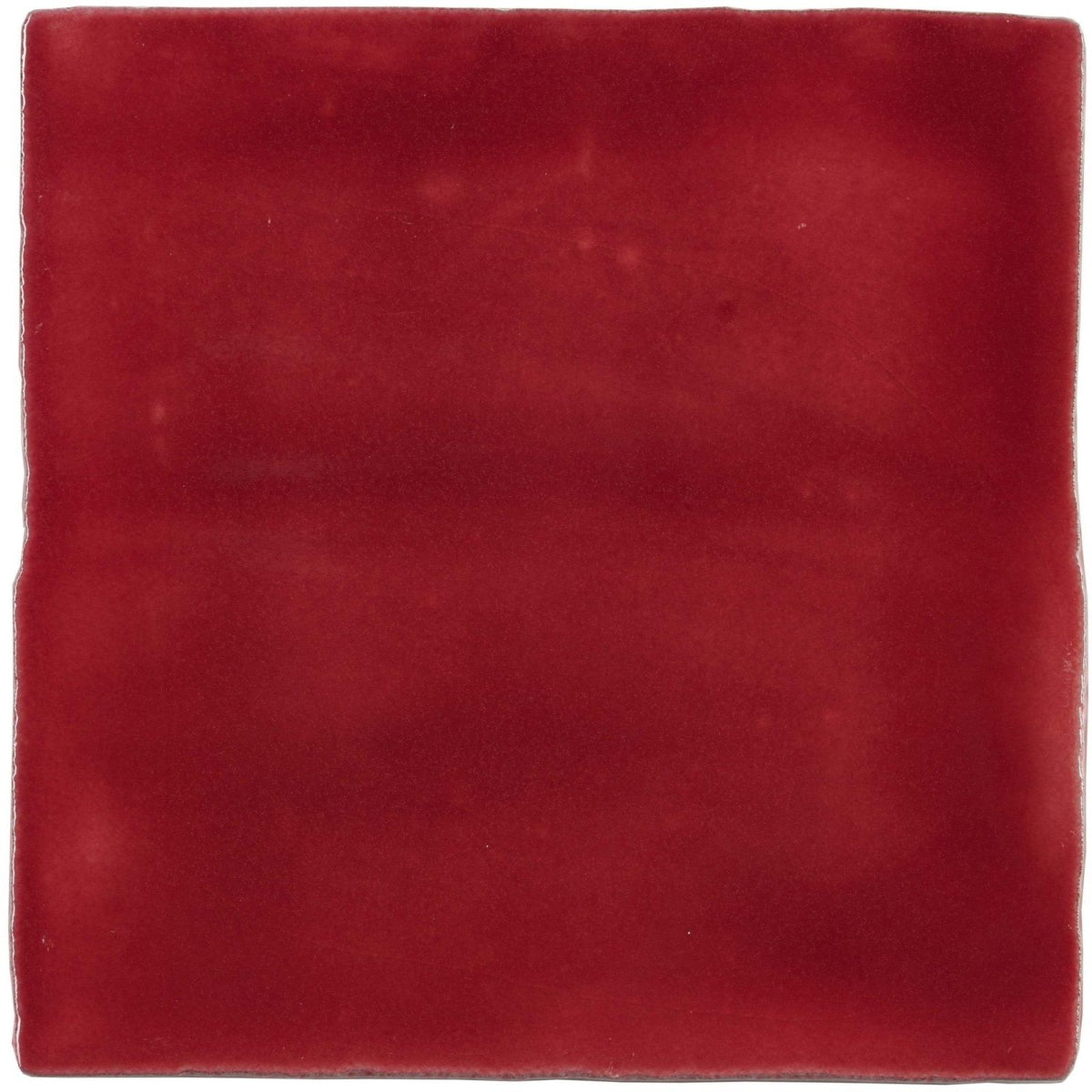 A square rioja field tile made of matte-finished ceramic in deep burgundy with subtle surface variations