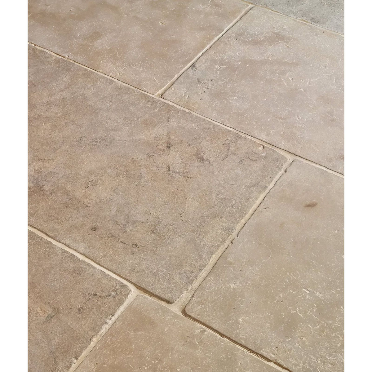 Beige riviera limestone tumbled stone tiles with natural veining and subtle texture for versatile flooring and walls