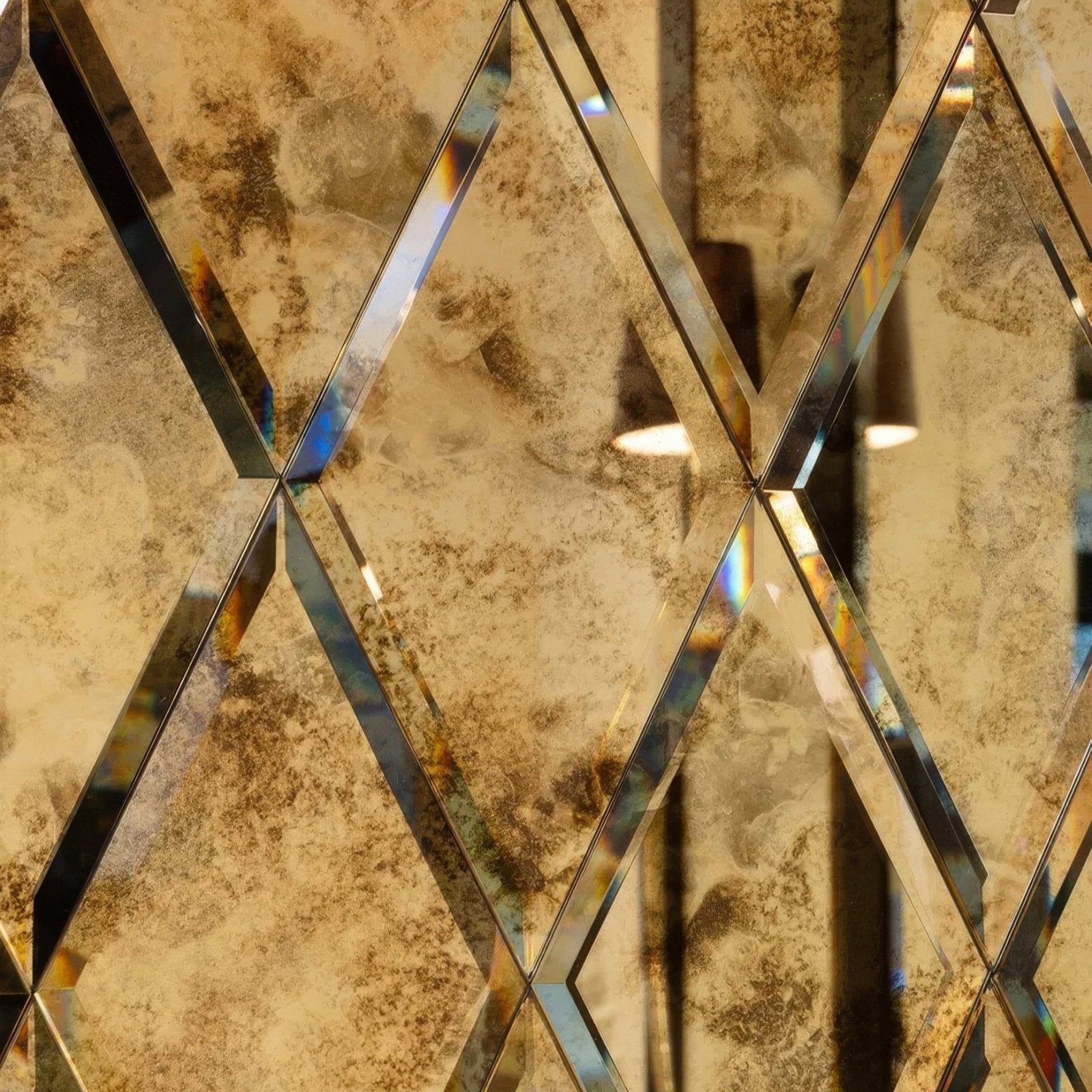 Diamond shaped mirrored tiles with distressed antique gold finish and black beveled edges in rococo mirror diamond glass brass