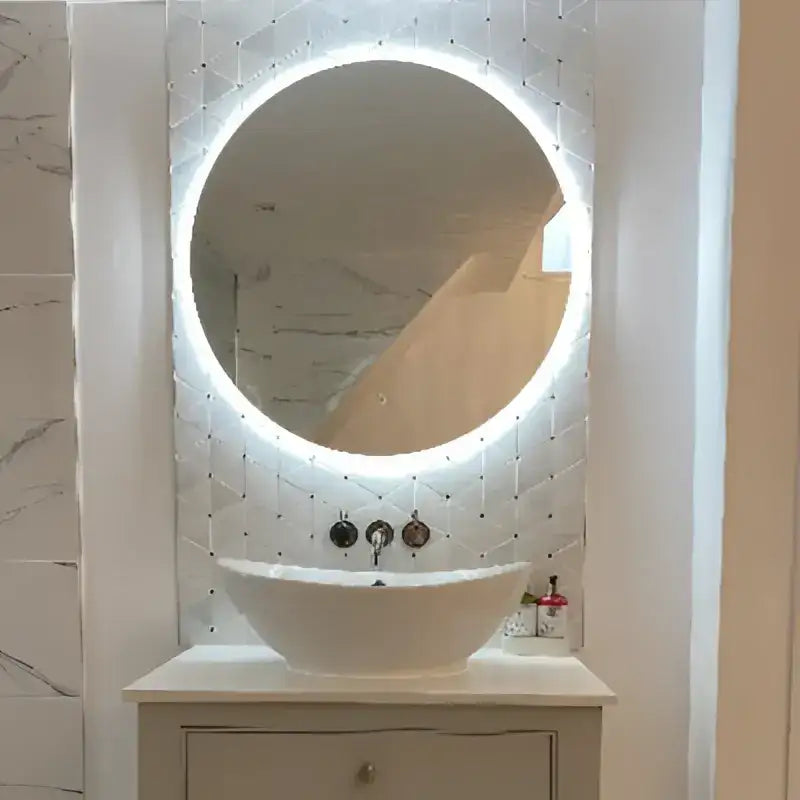 Round white illuminated mirror with a sleek, modern design.