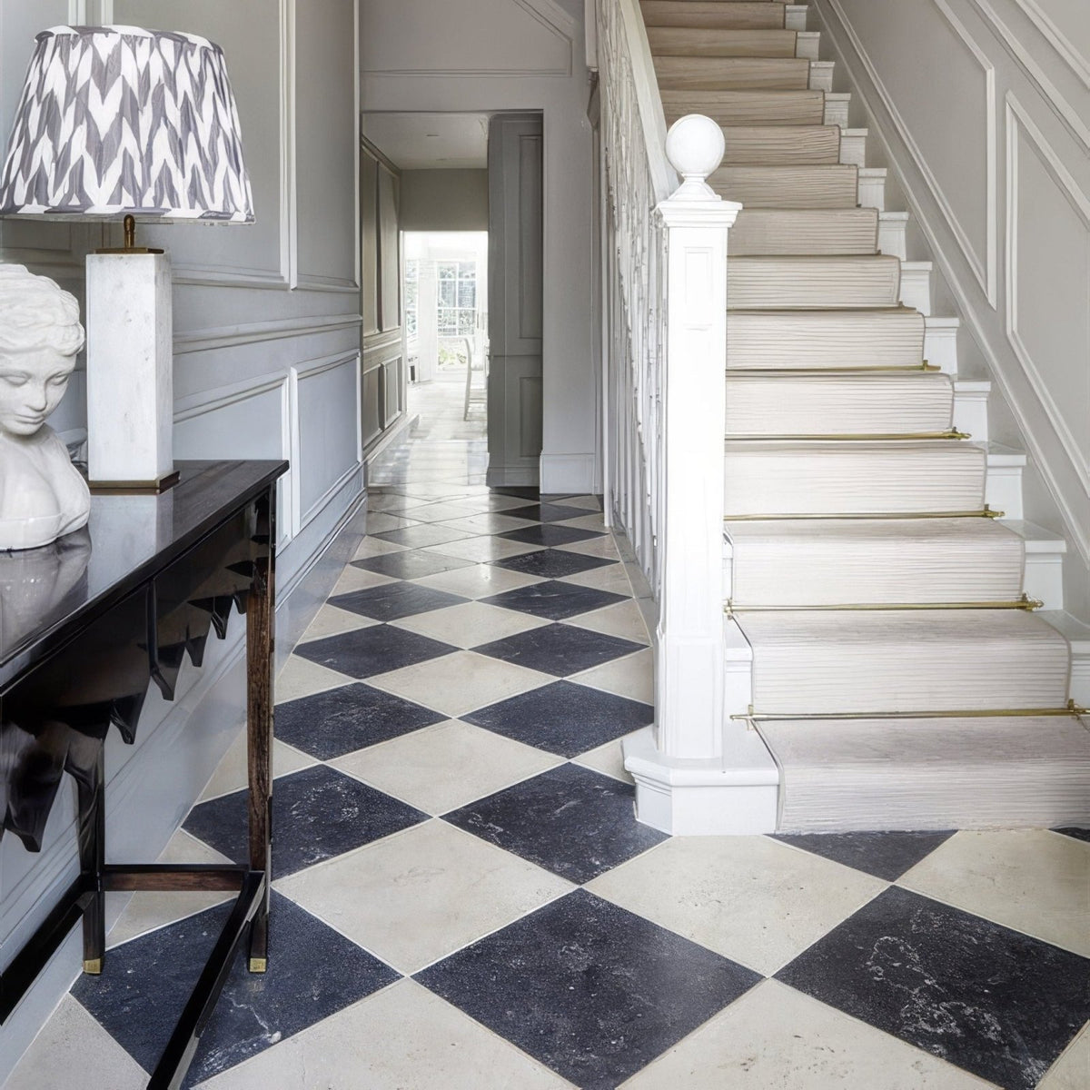 Black and white marble diamond patterned floor tiles in royal mink limestone tumbled finish for elegant flooring