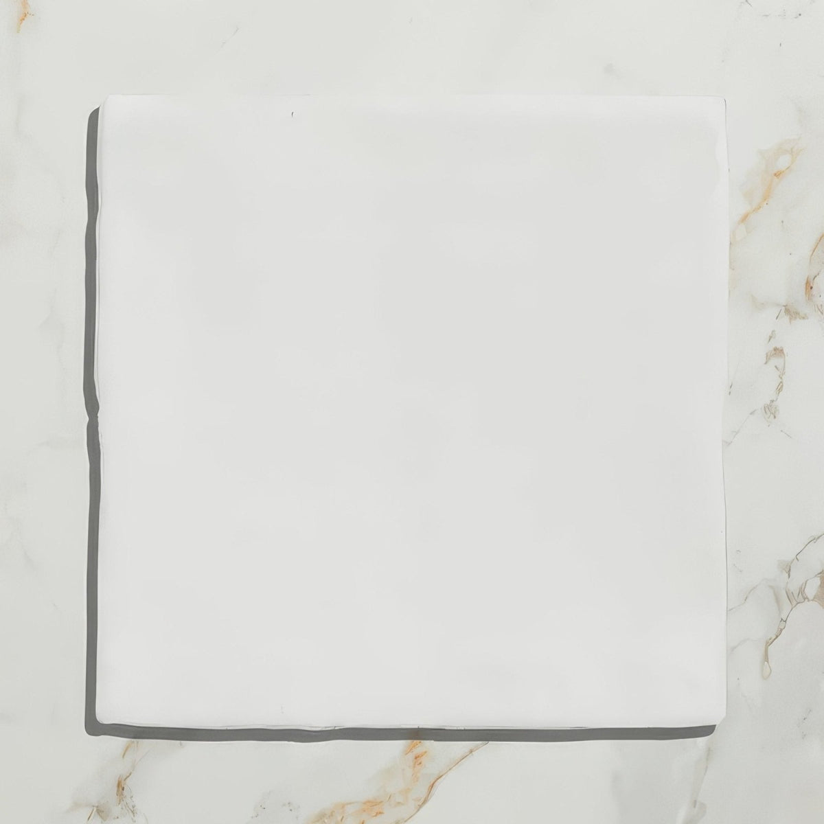 A crisp white handkerchief with smooth soft texture paired with rural ceramic shell decor
