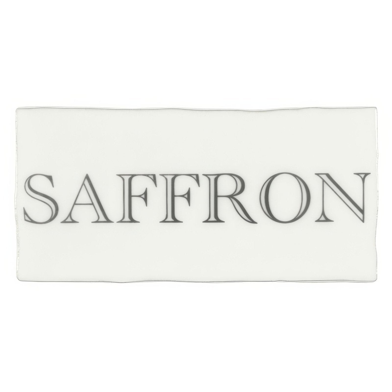A rectangular white cotton scarf with the word saffron in dark gray serif font across the center