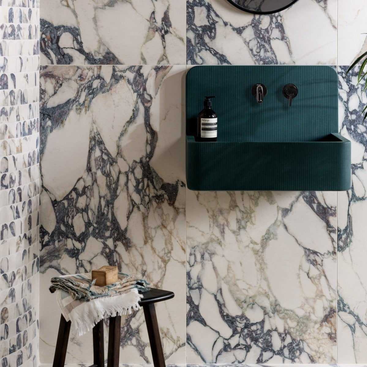 Teal ribbed wall-mounted porcelain sink with matt arch mosaic design and sleek modern style from savoy novo