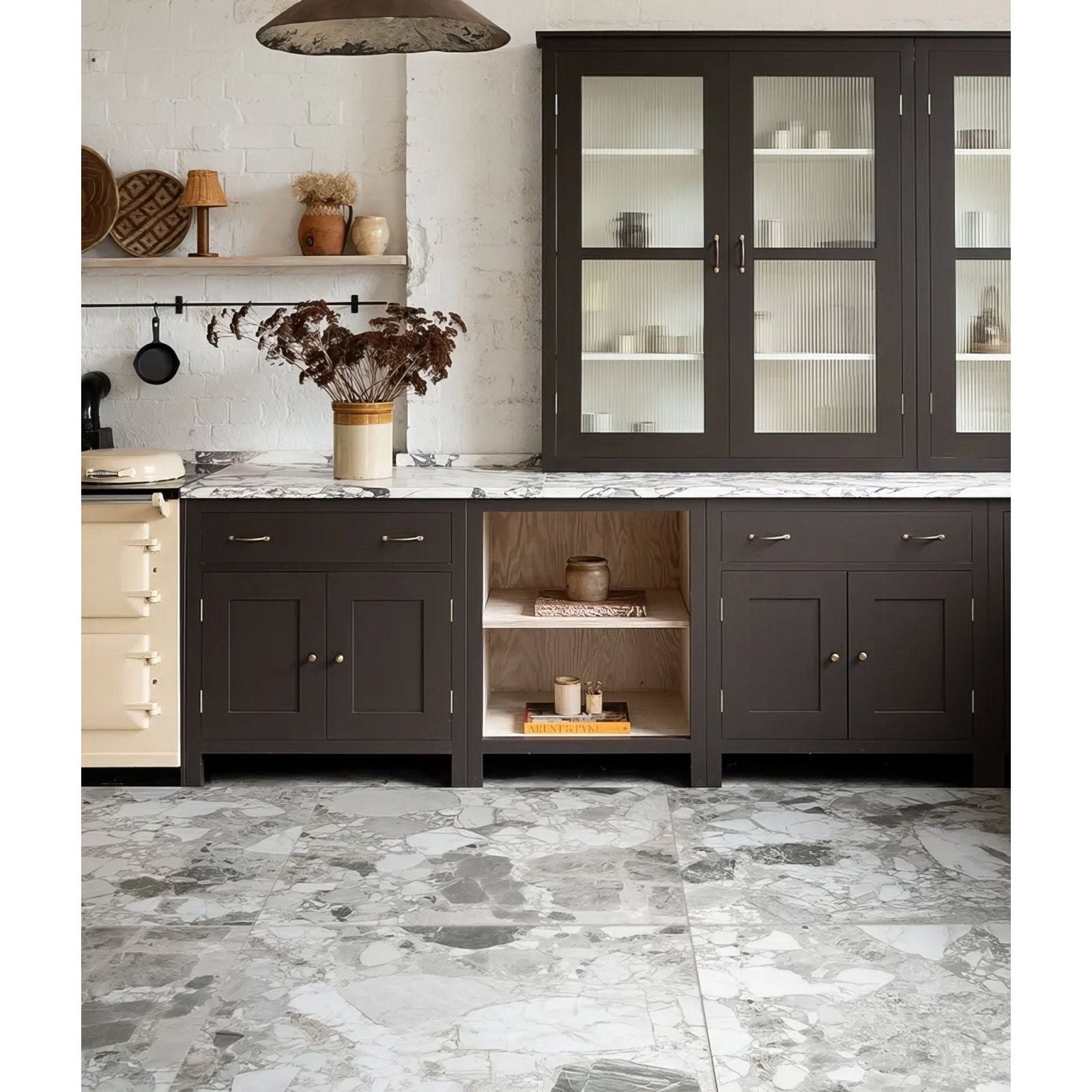 Sculpture Grande Porcelain Ceppo grey terrazzo-effect tiles with dark brown kitchen cabinets