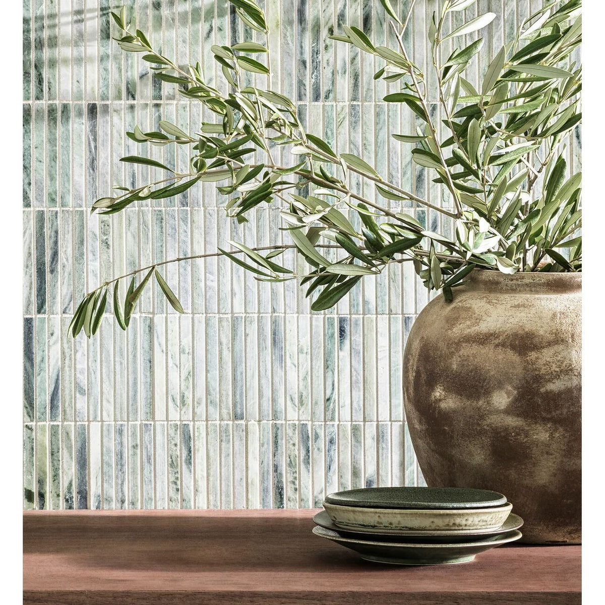 Seaspray Green Stacked Mosaic green and white marble stacked mosaic with a ceramic vase of olive branches