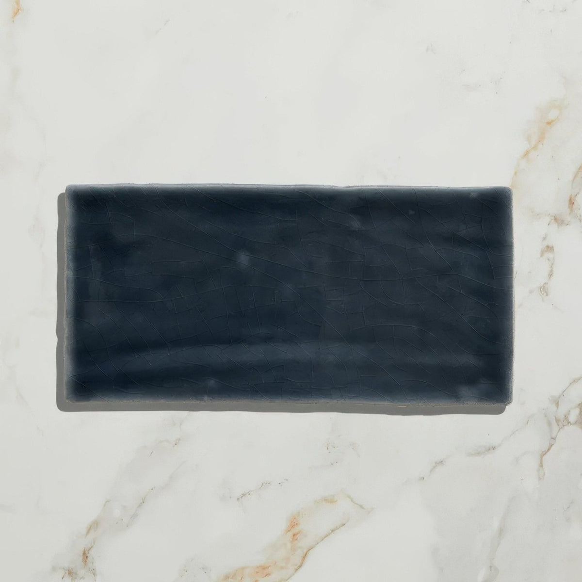 Dark gray rectangular ceramic tile with matte slightly textured surface from seaton ceramic beach hut collection