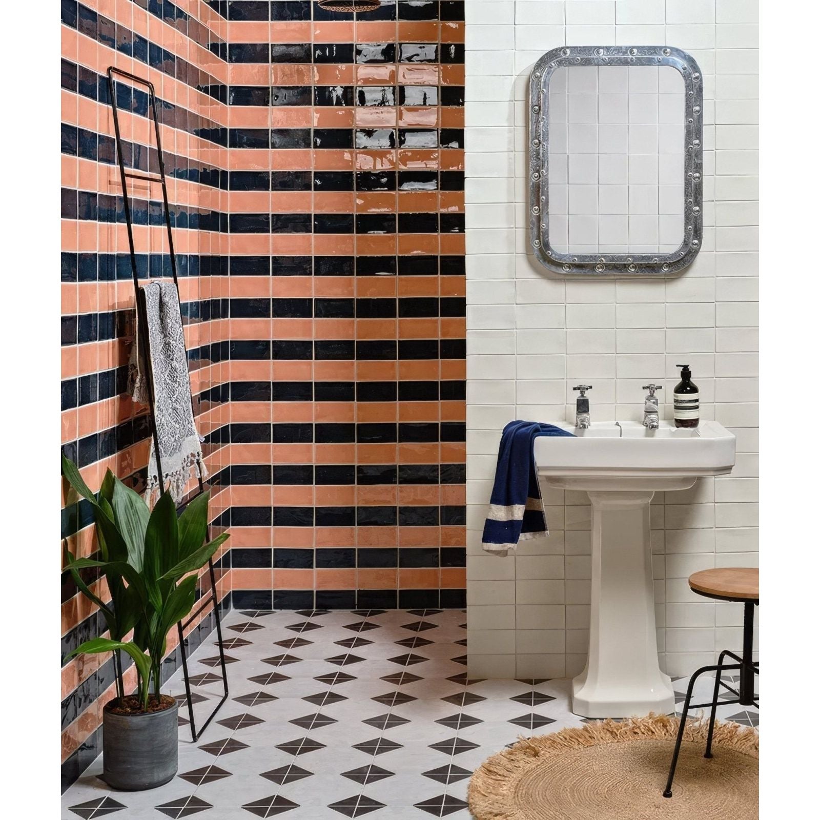White ceramic pedestal sink with chrome faucets and blue and white striped towel in seaton ceramic beach hut design