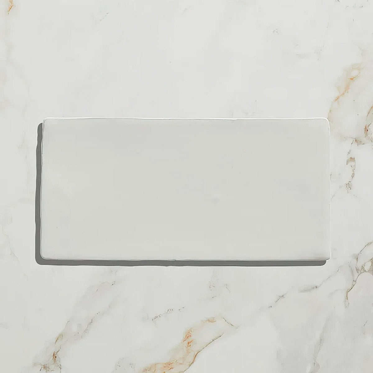 A sleek rectangular white ceramic tile with a glossy finish for Seaton Ceramic Ice Cream product display