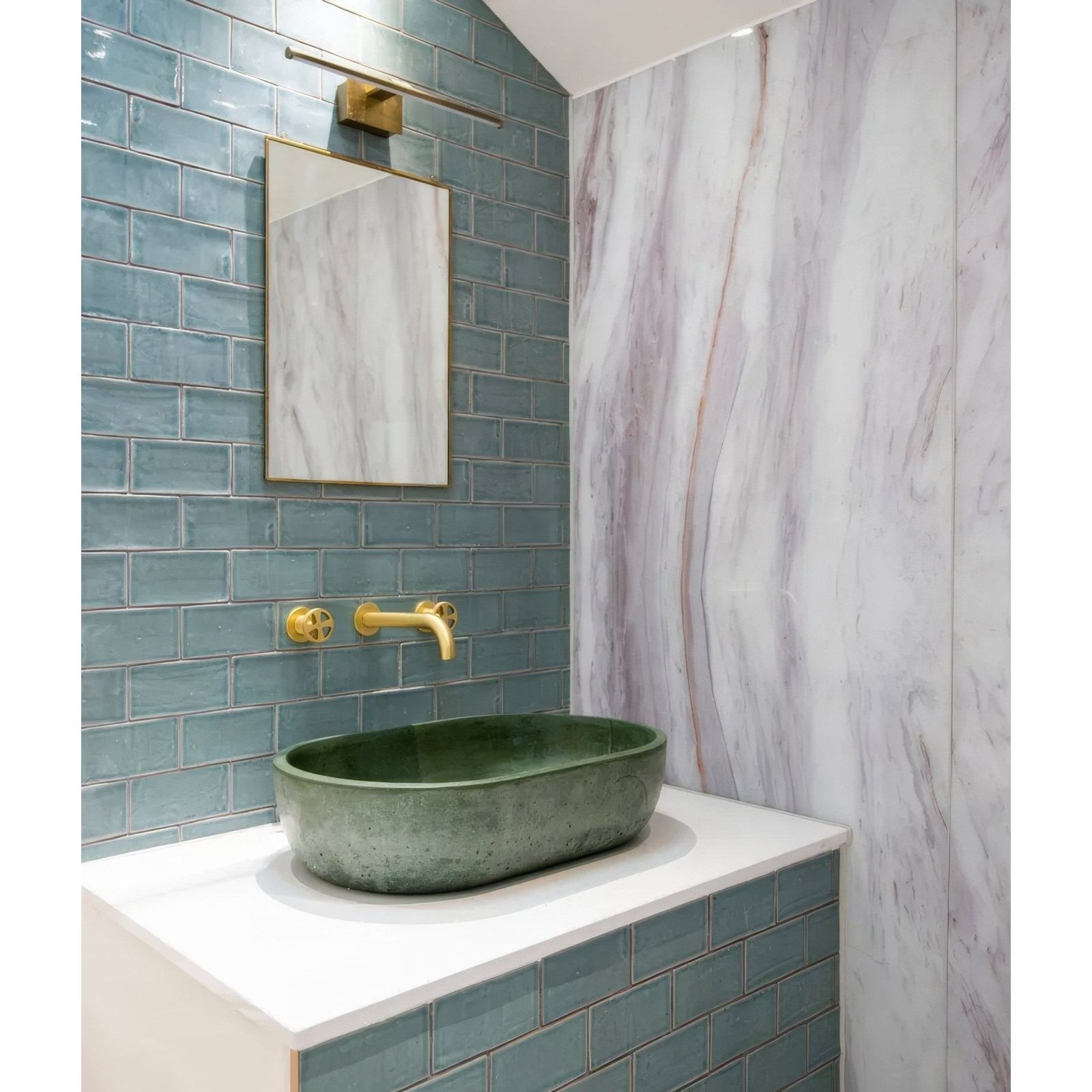 Oval-shaped green ceramic sink with matte speckled finish on white countertop from seaton ceramic rock pool collection