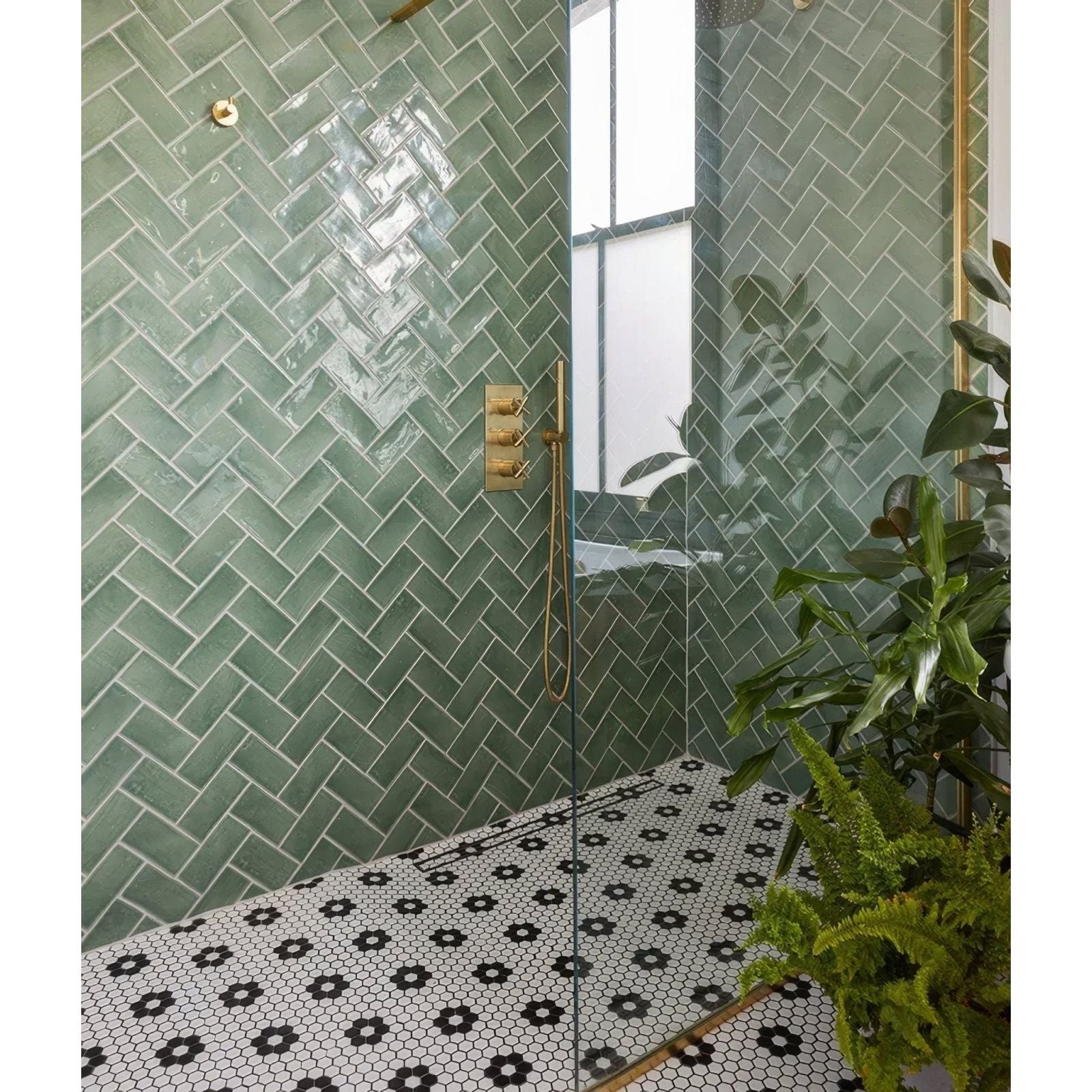 Seaton ceramic sea cabbage green herringbone glass shower tiles with a glossy finish for bathroom walls