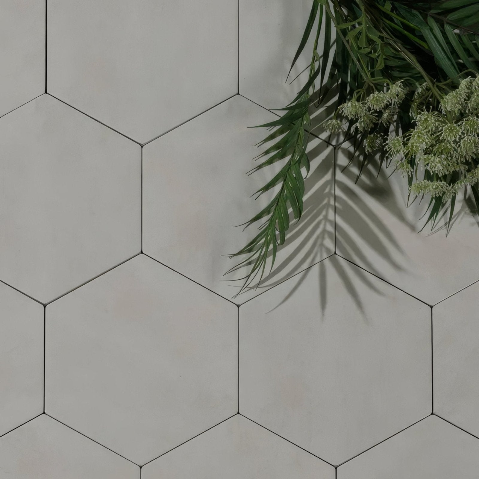 Shadow white field porcelain white hexagonal tiles with thin black grout lines for stylish flooring or walls