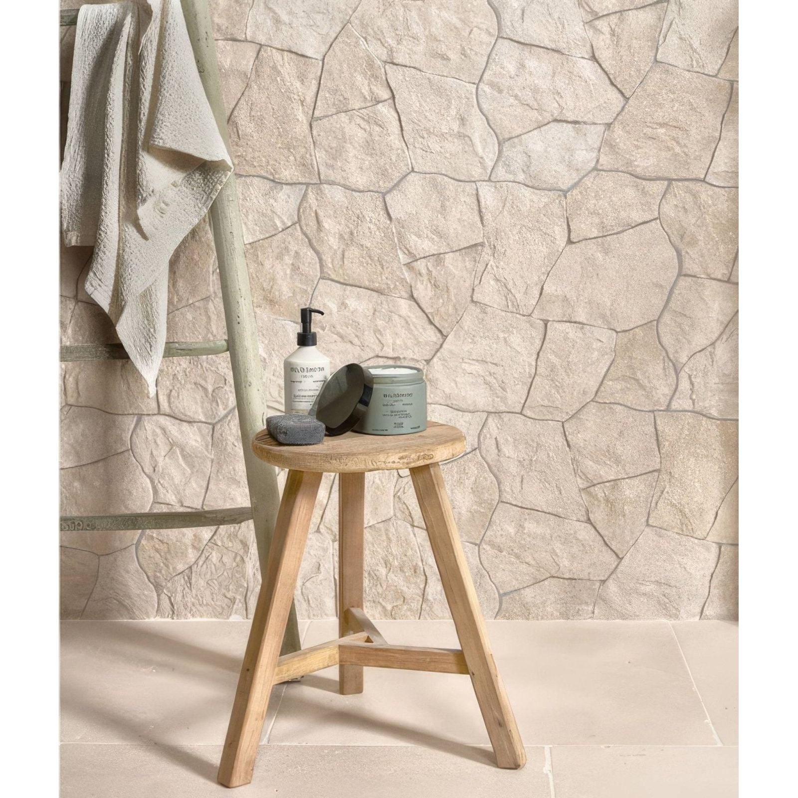 Light wood three-legged stool with round seat featuring sierra porcelain textured finish