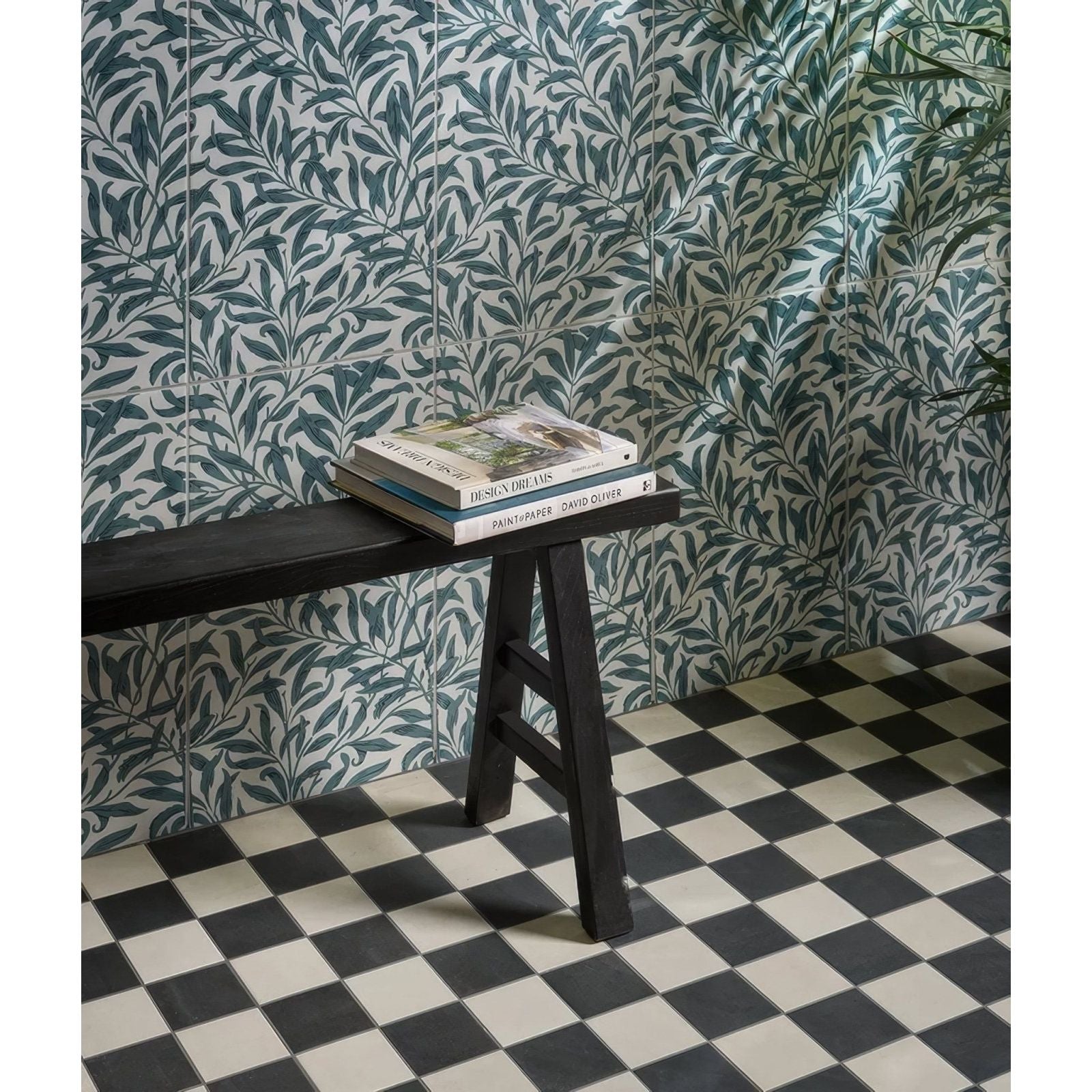 Black wooden bench with simple sturdy design and three legs featured in silk screen ceramic willow cottage teal product