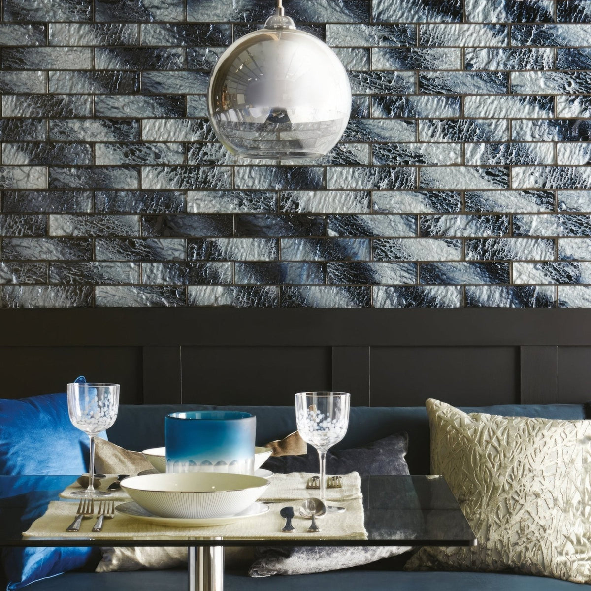Siva Brickbond Mosaic dark grey and black glass brick mosaic with a spherical glass pendant light