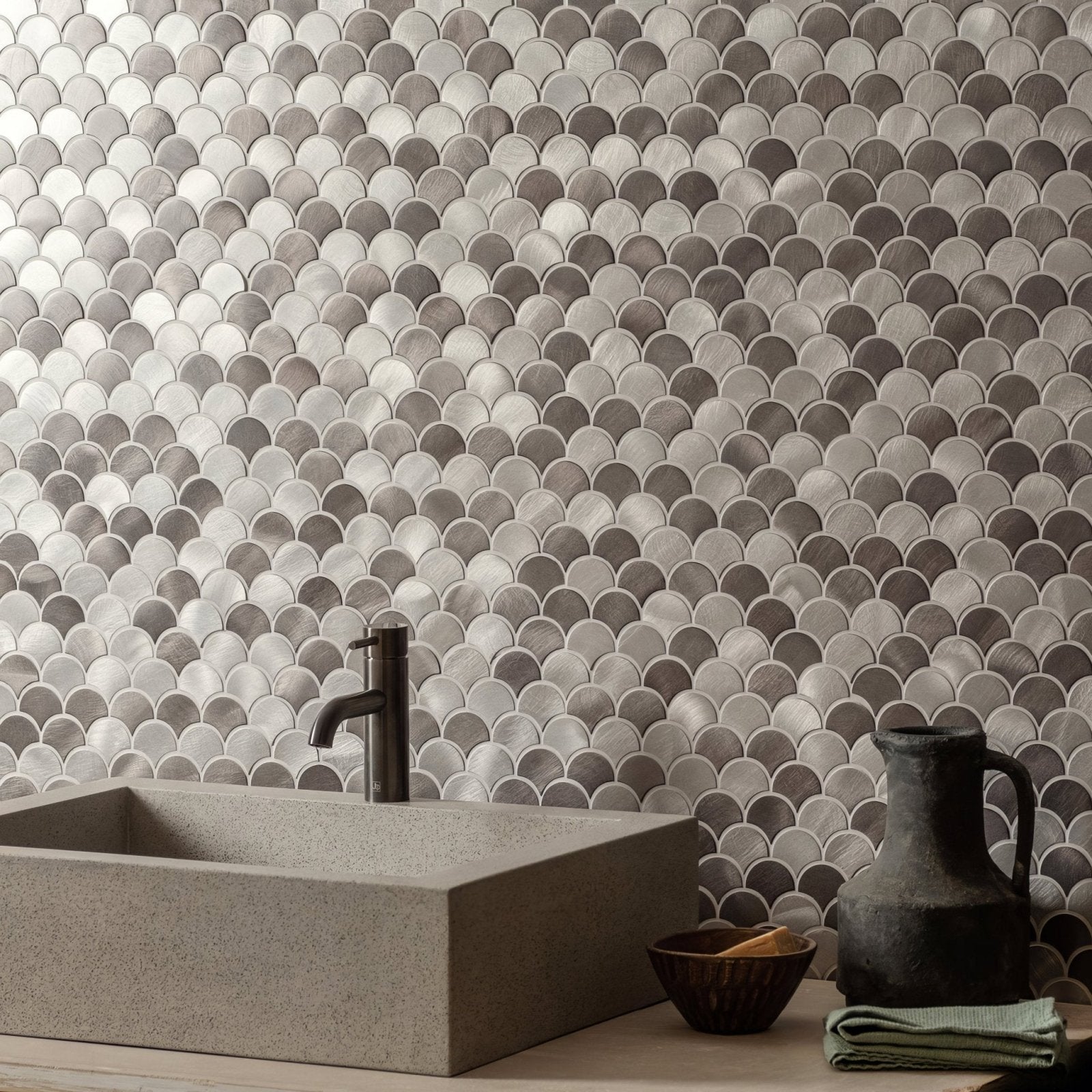 Shiny metallic gray scalloped aluminum mosaic tile wall featuring skaro grey and silver mix scale design