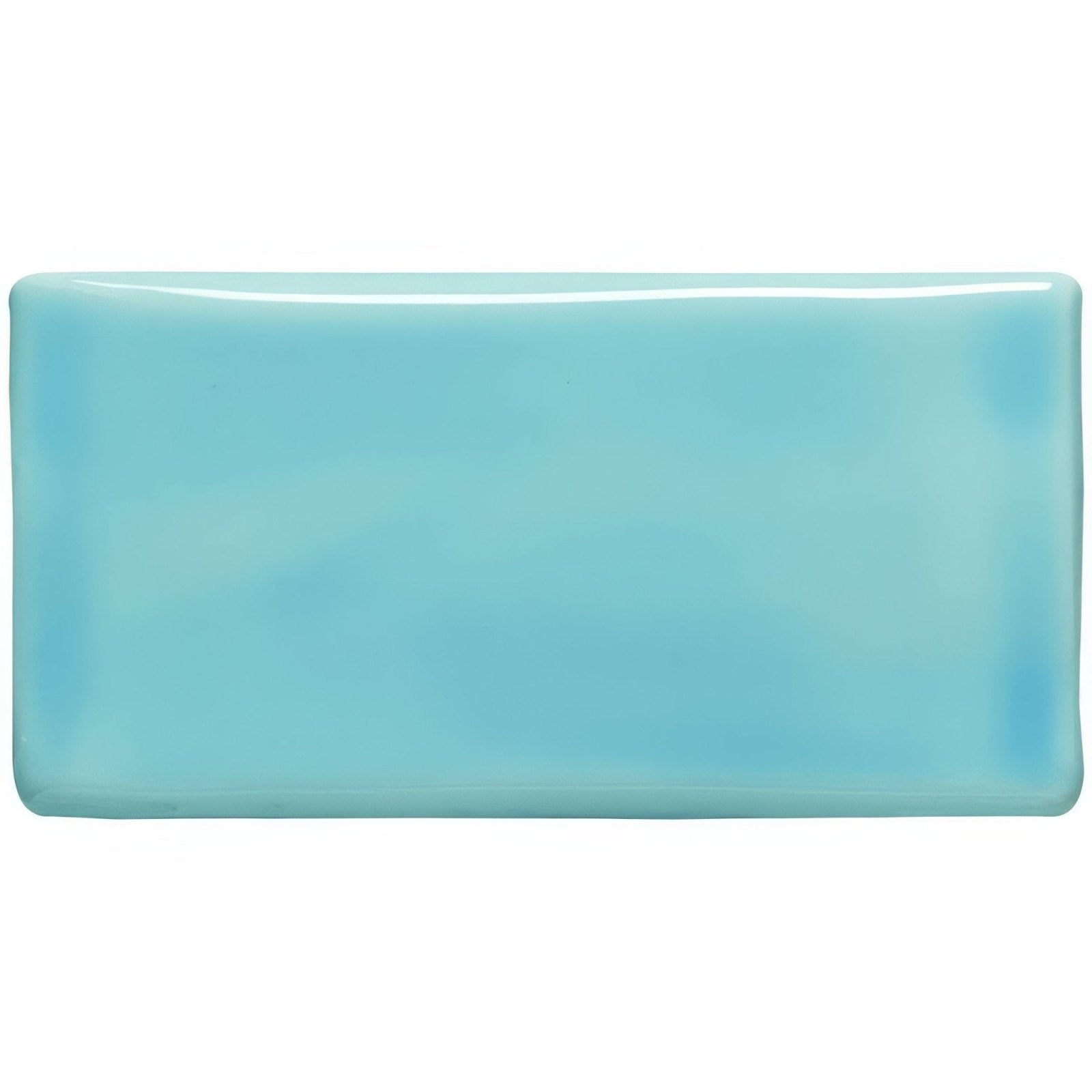 A rectangular glossy turquoise ceramic sky blue half tile with softly rounded edges