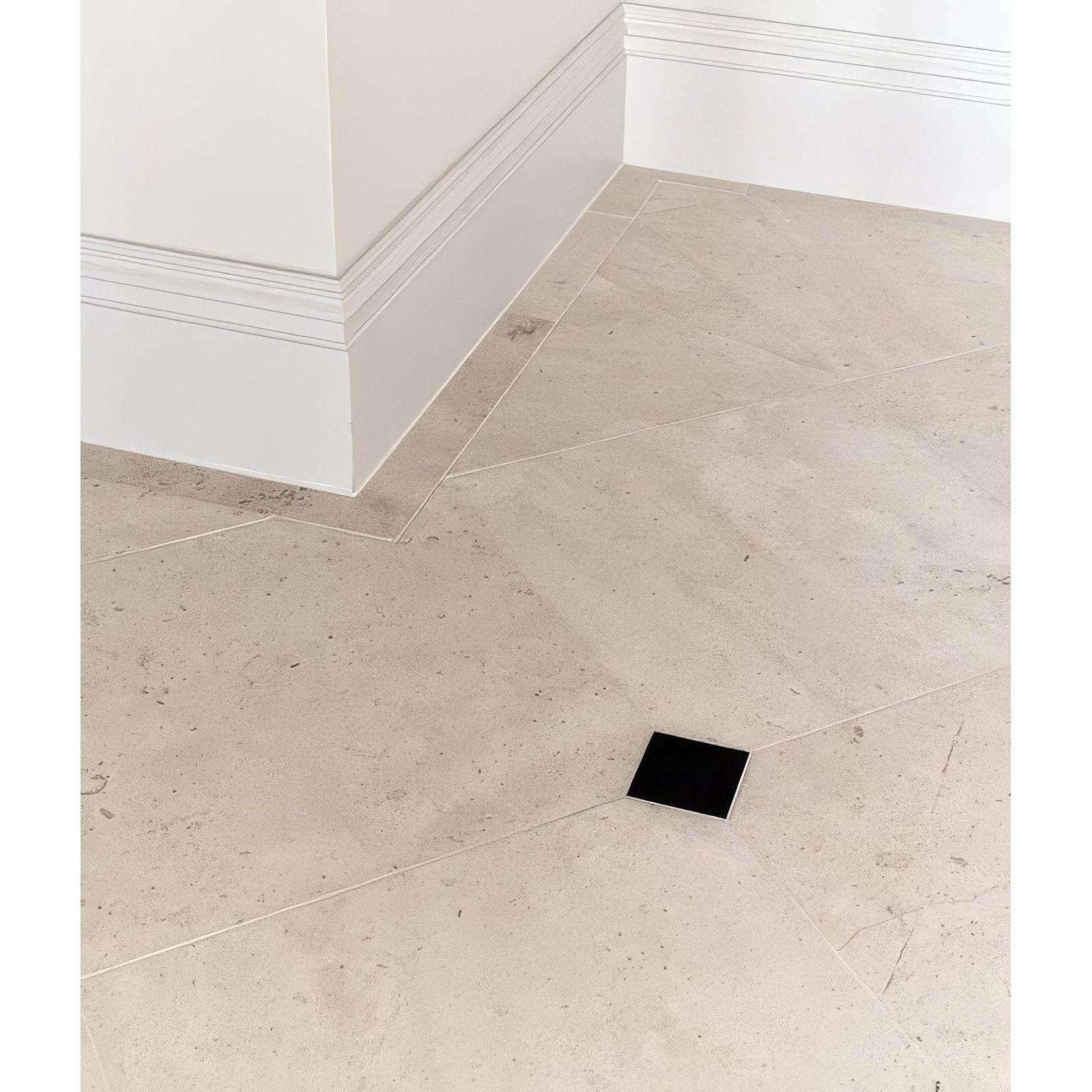Black square sloane limestone floor tile with honed finish showcasing smooth natural stone texture