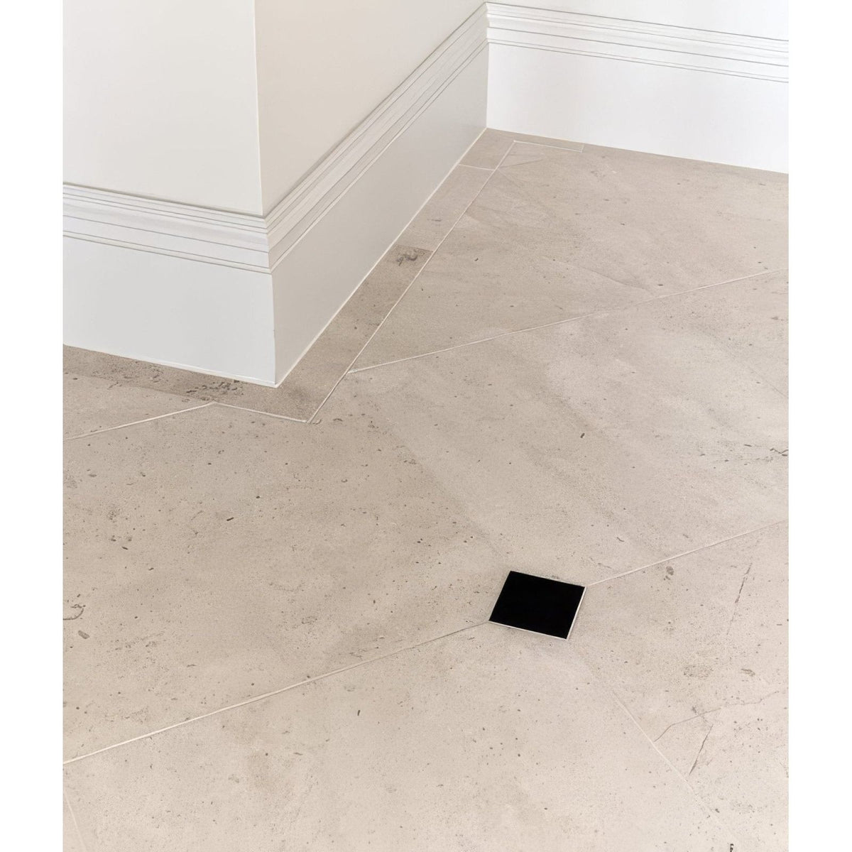Black square sloane limestone floor tile with honed finish showcasing smooth natural stone texture