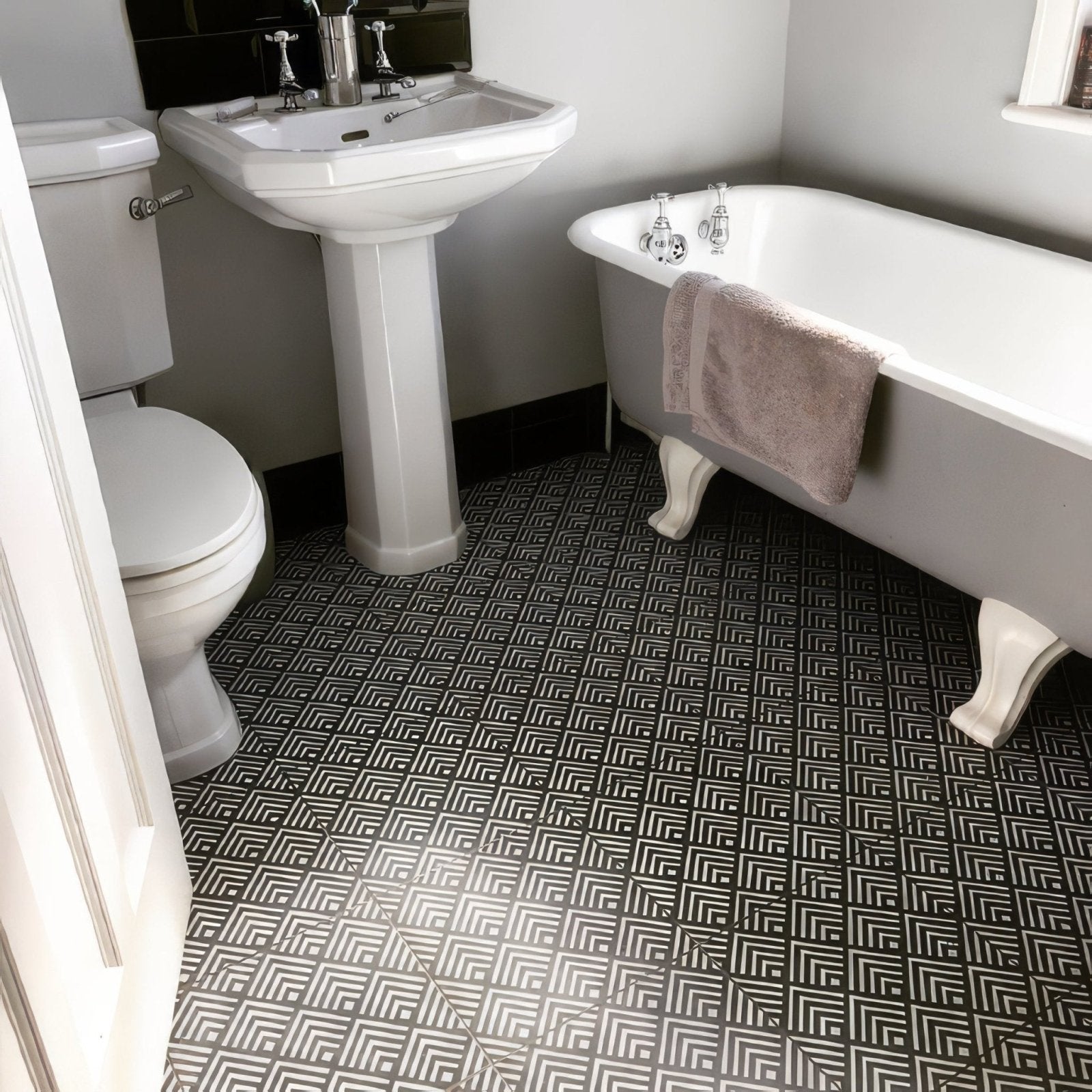 Black and white geometric patterned porcelain floor tiles from the sorrento correale collection for bathrooms