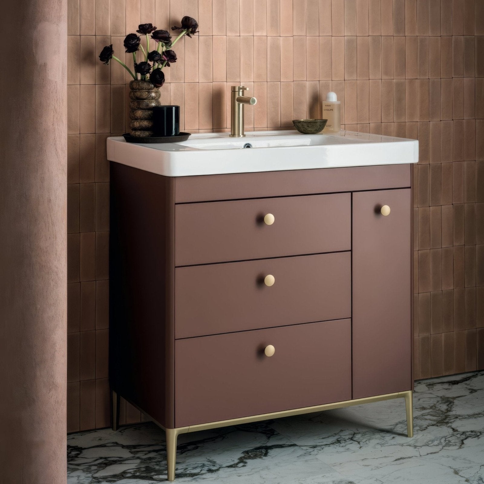 Brown vanity with white countertop and gold-tone hardware featuring south cliff terra brick tile backsplash