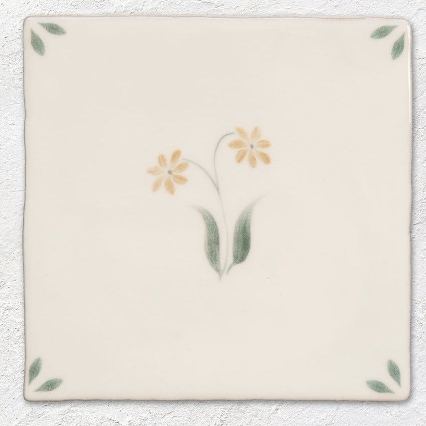 Spring elsie 13 x 13cm cream ceramic tile with hand-painted yellow flowers green leaves and corner leaf motifs