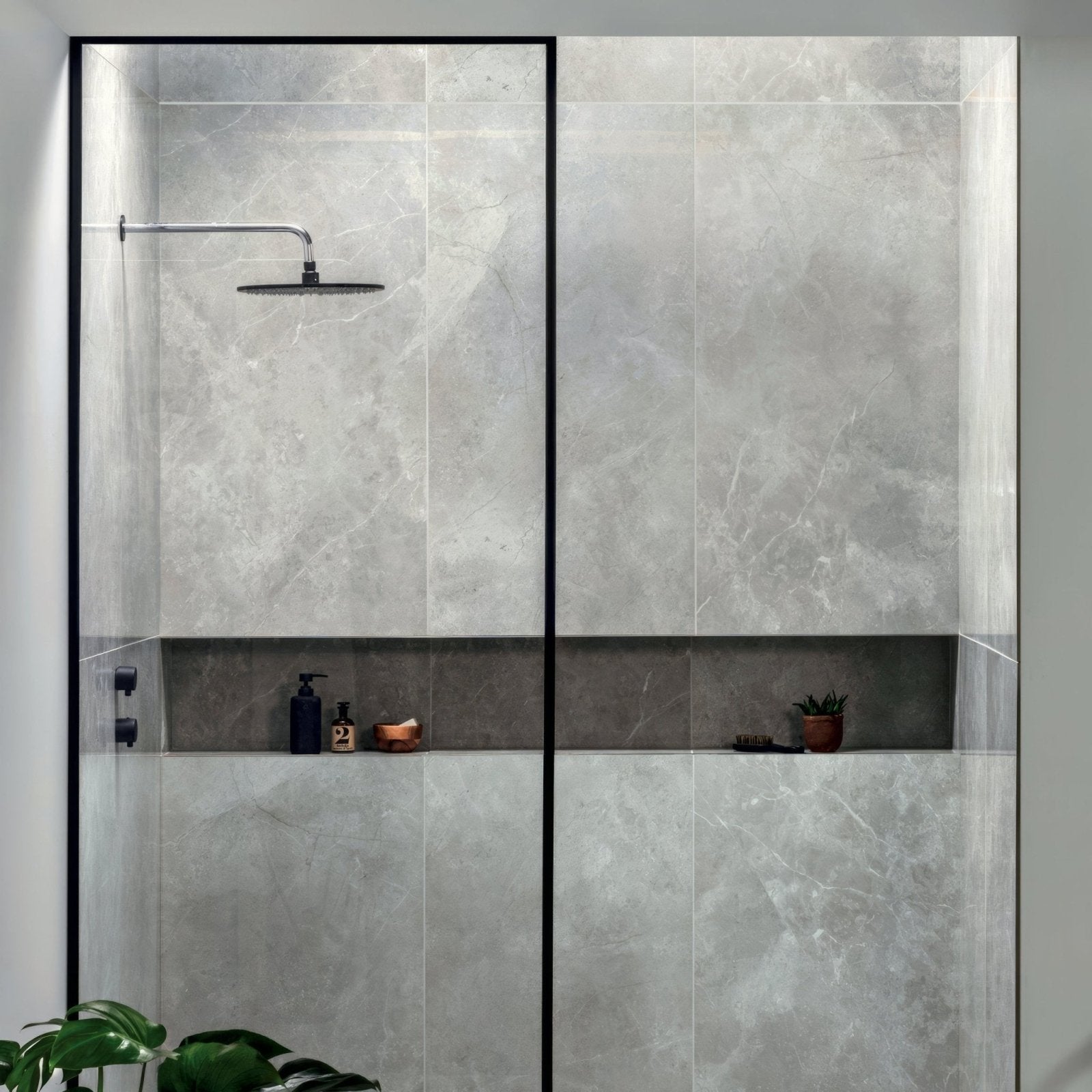St Martin 120x60 Polished grey marble-effect tiles with a black-framed shower enclosure