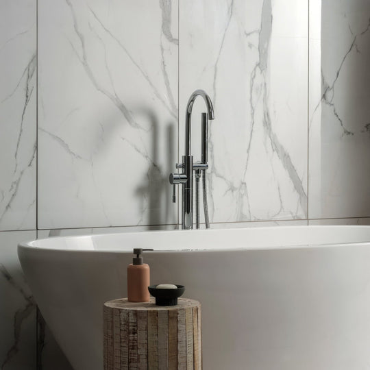 Statuario Nuovo 120x60cm white marble-effect tiles with a bathtub and chrome tap
