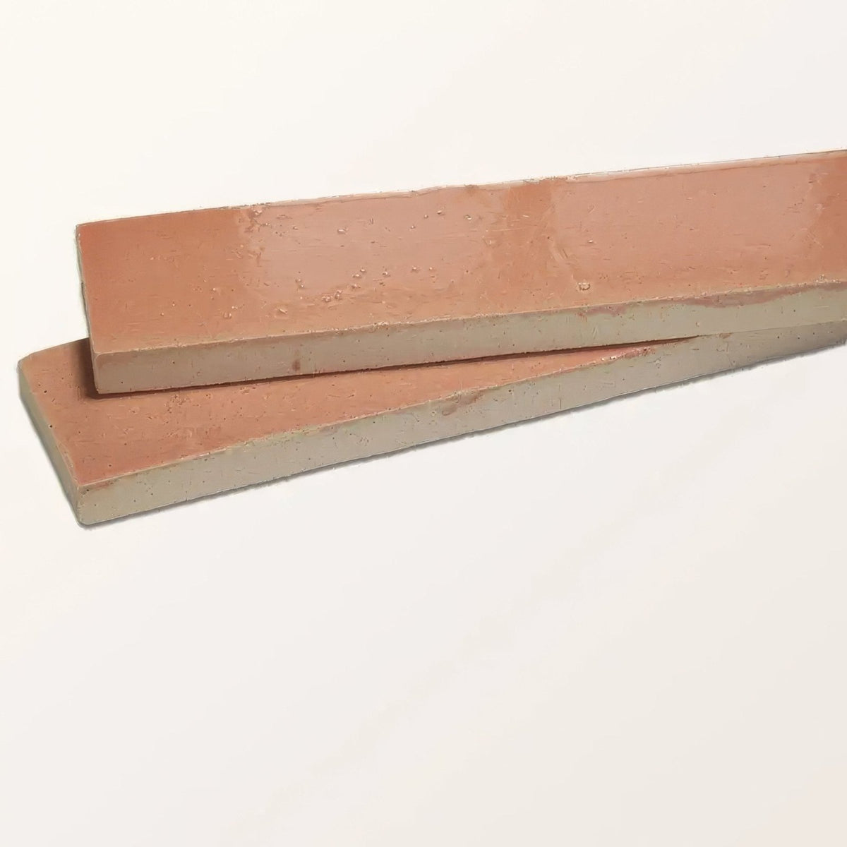 Two terracotta stone glaze ceramic blossom gloss brick tiles with a matte finish and subtle surface texture