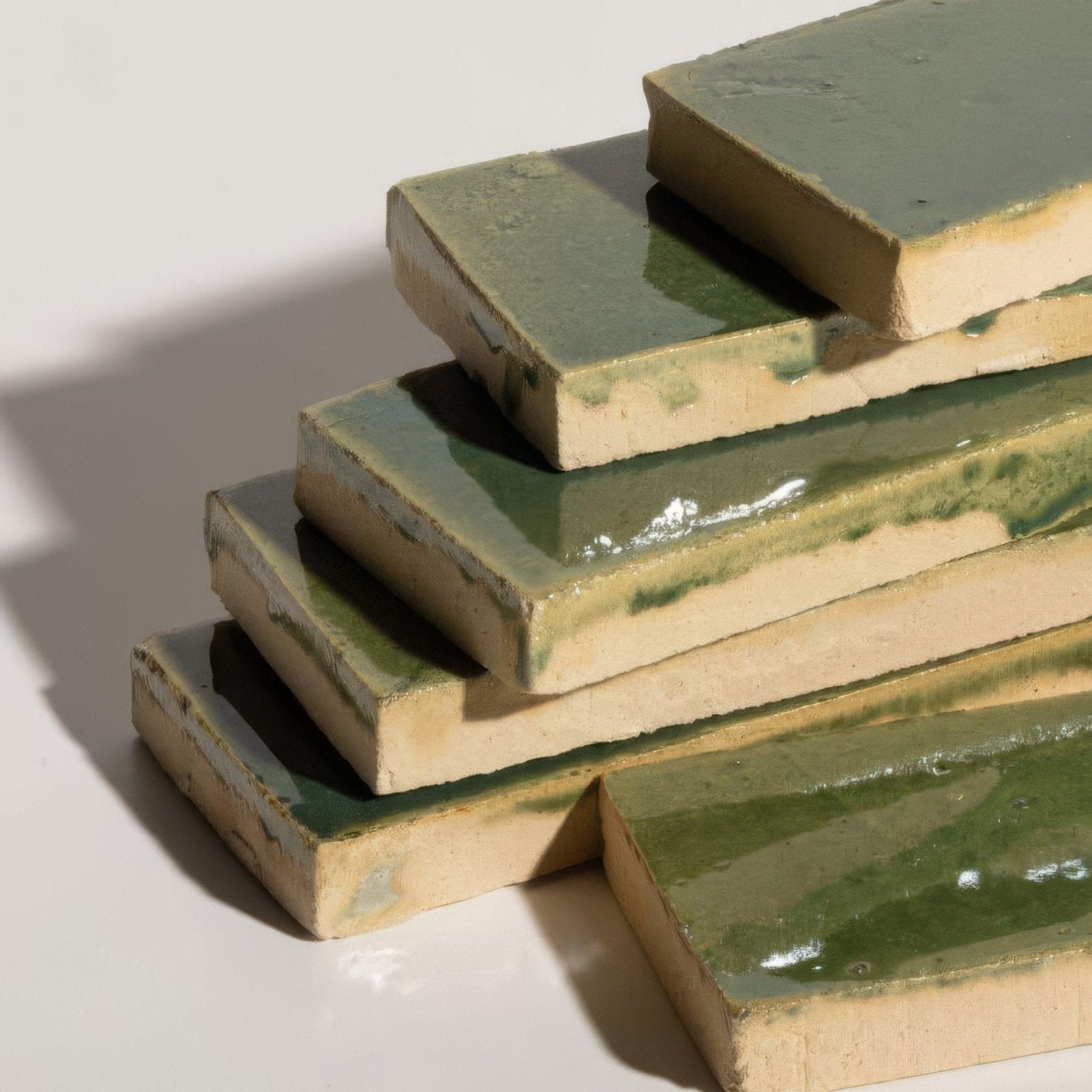 Stacked rectangular stone glaze ceramic british green gloss brick tiles with glossy sage green glaze and unglazed beige edges