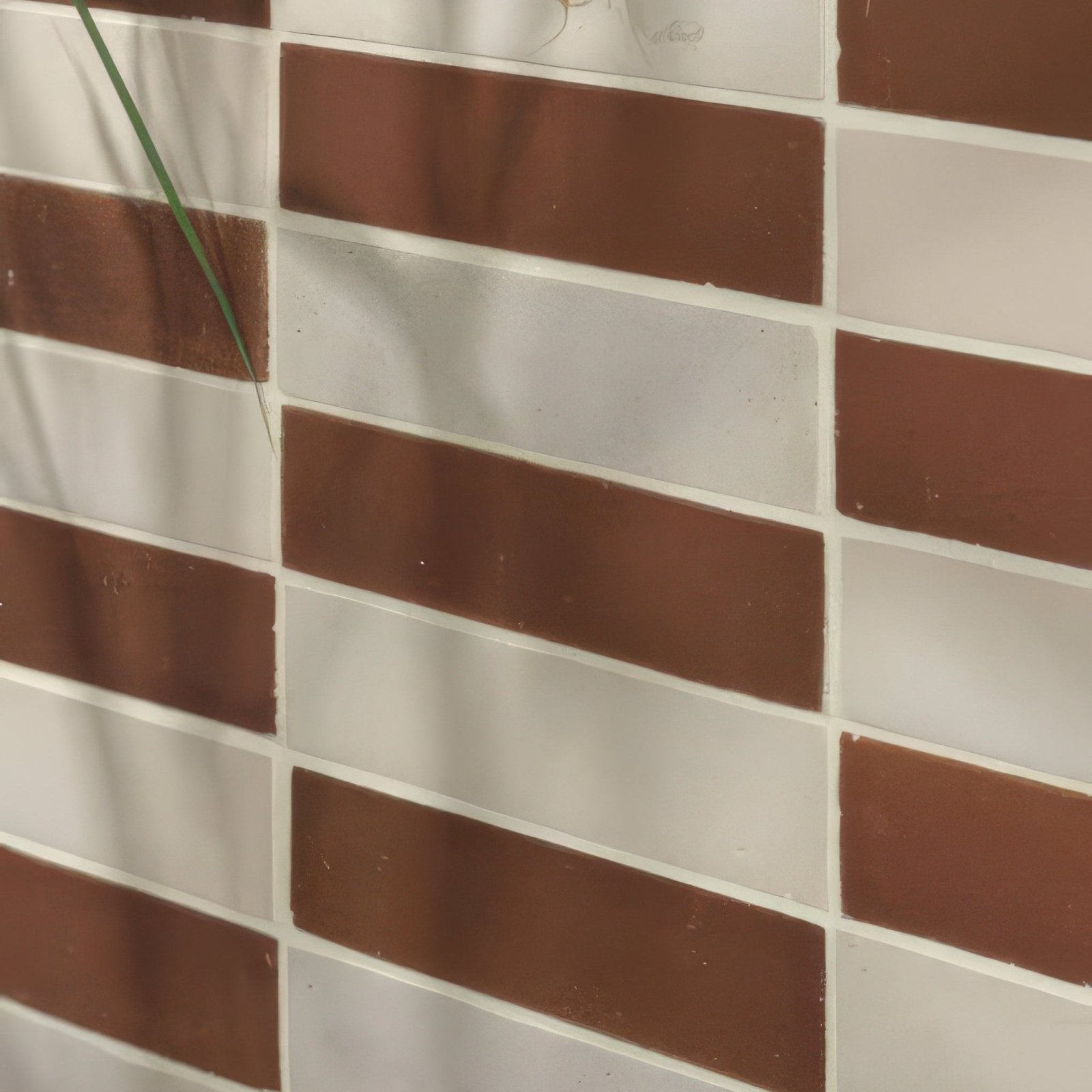 Brown and white rectangular stone glaze ceramic chalkstone gloss brick tiles arranged in staggered brick pattern