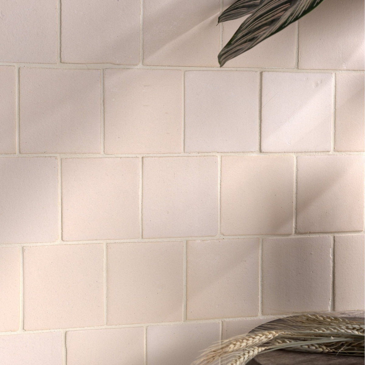 Off-white square ceramic chalkstone matt tiles with subtle texture and clean grout lines for wall and floor use
