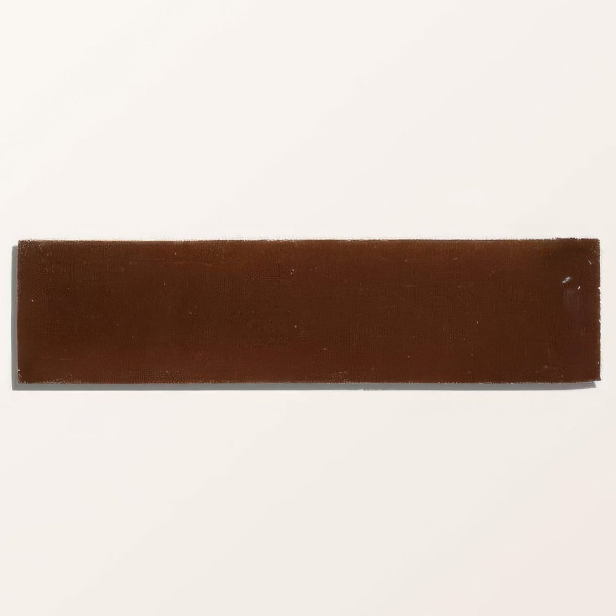 A rectangular brown stone glaze ceramic tile with a smooth, slightly glossy finish and subtle texture cola gloss brick