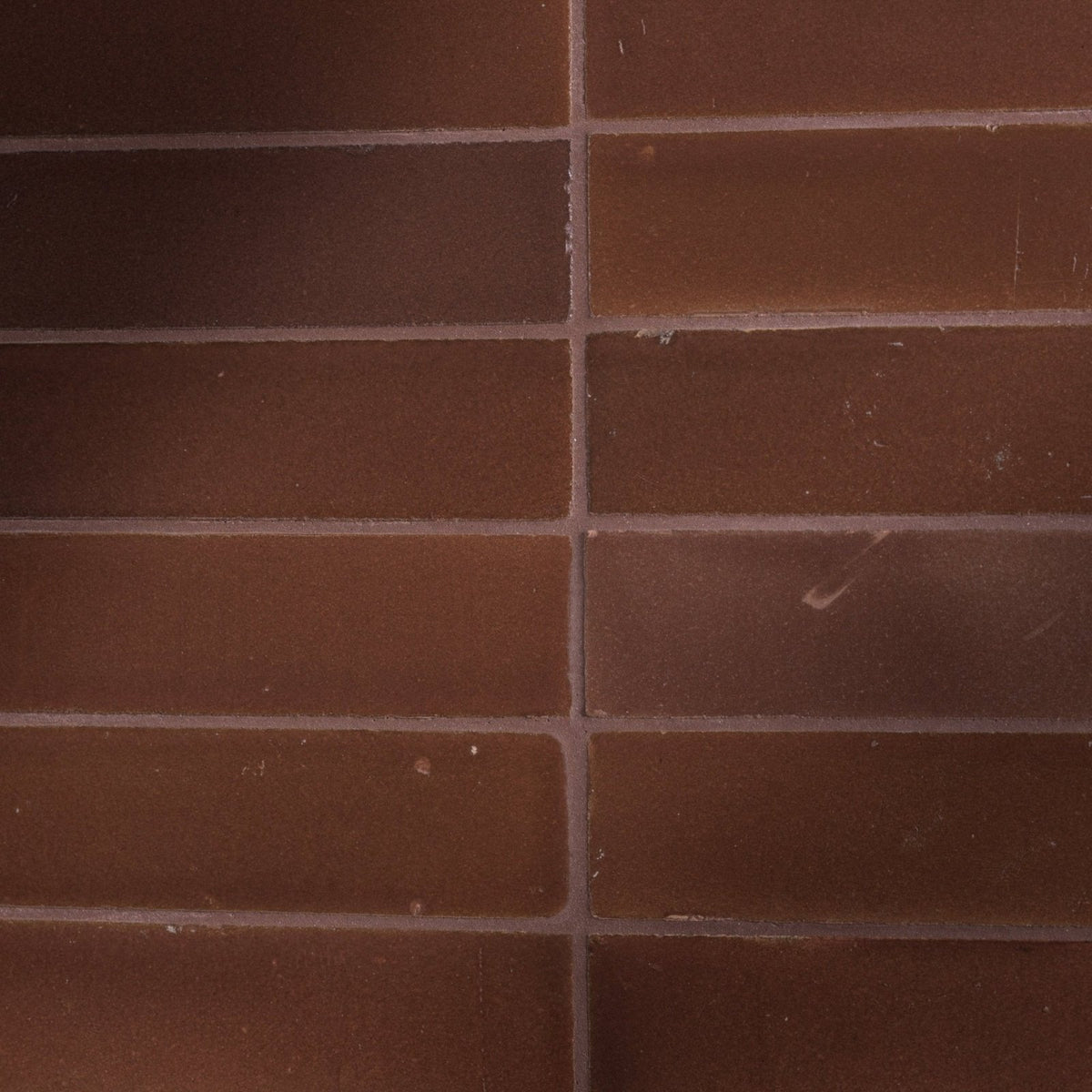 Brown rectangular stone glaze ceramic cola gloss brick tiles with subtle tone variations and minor surface imperfections