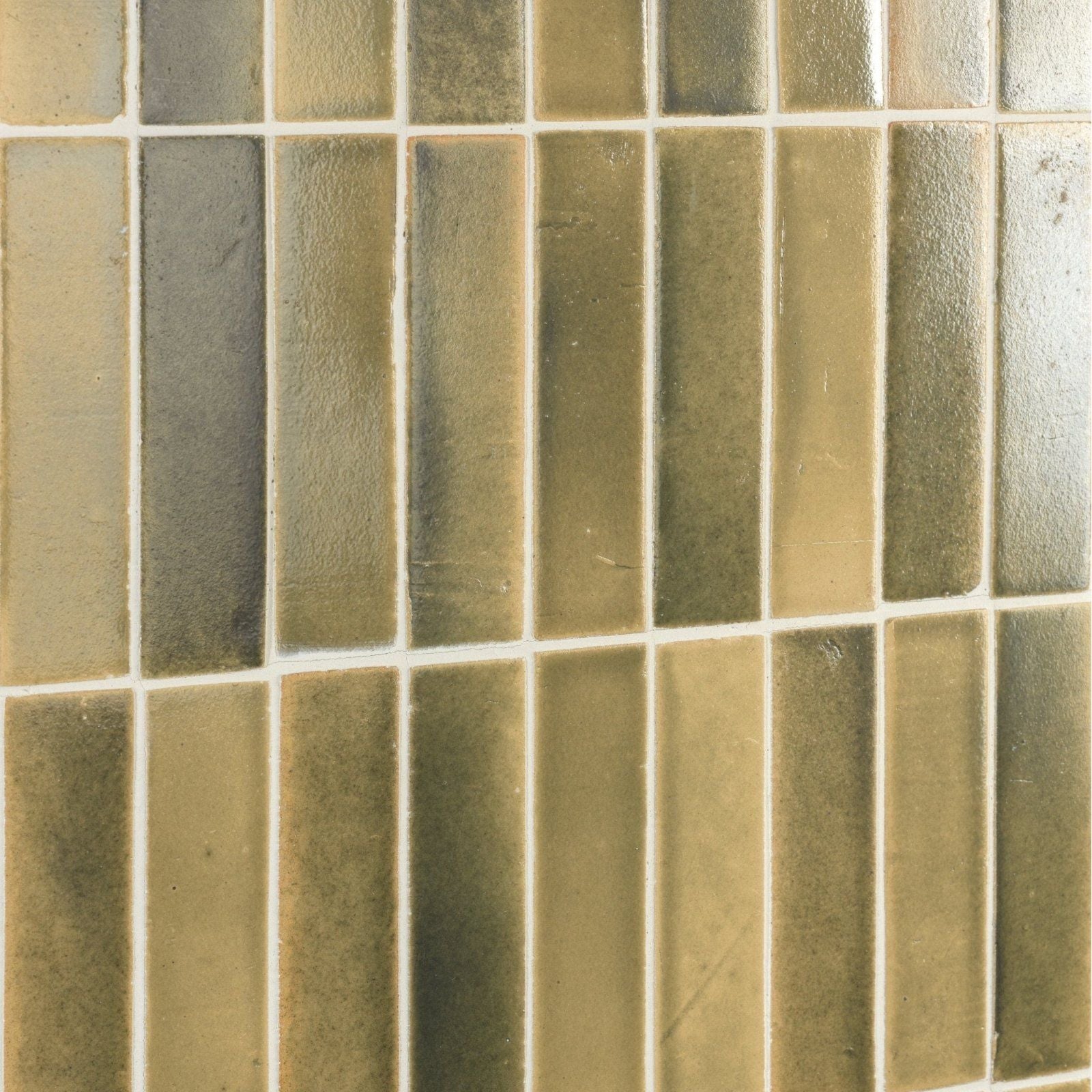 Rectangular glass mosaic tiles in earthy green and beige tones with white grout from stone glaze ceramic lemongrass gloss brick