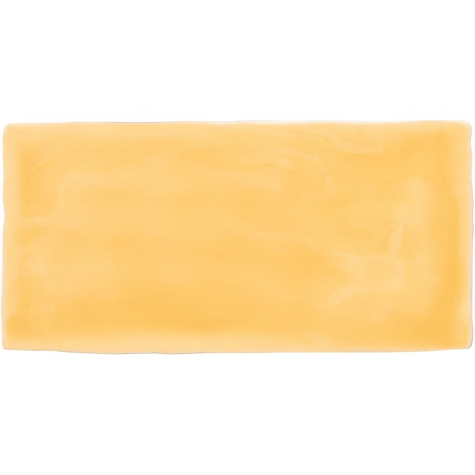 A rectangular block of pale yellow cheese with a smooth glossy surface for straw brick tile product