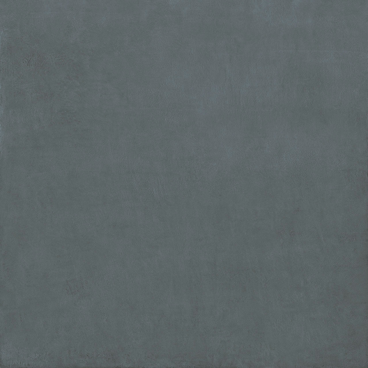 A matte-finished dark gray porcelain tile with subtle texture from the stucco porcelain textured blue collection