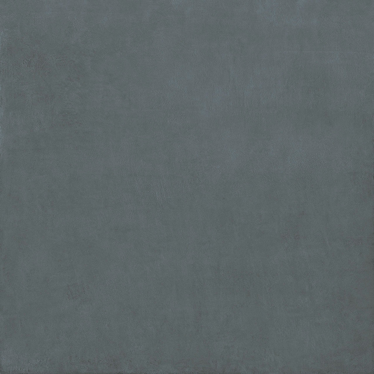 A matte-finished dark gray porcelain tile with subtle texture from the stucco porcelain textured blue collection