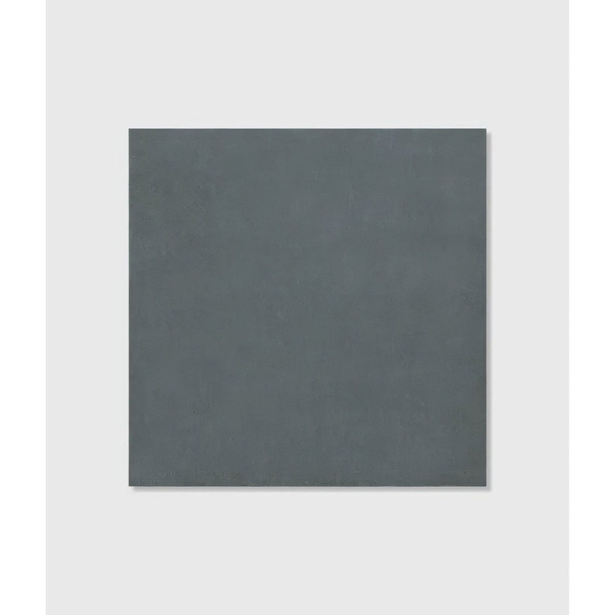 A matte dark gray stucco porcelain textured tile with a subtle surface ideal for modern flooring and walls