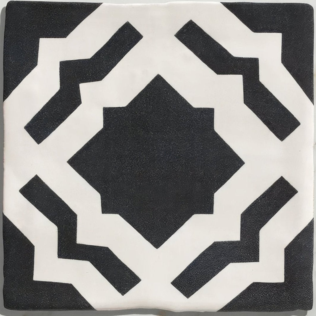 Studio cassius blue ceramic tile with black and white bold symmetrical geometric pattern made of ceramic material